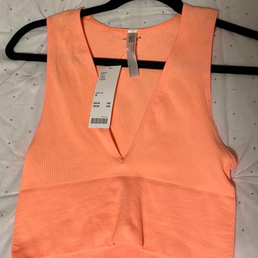 Out from under seamless plunge, top neon orange